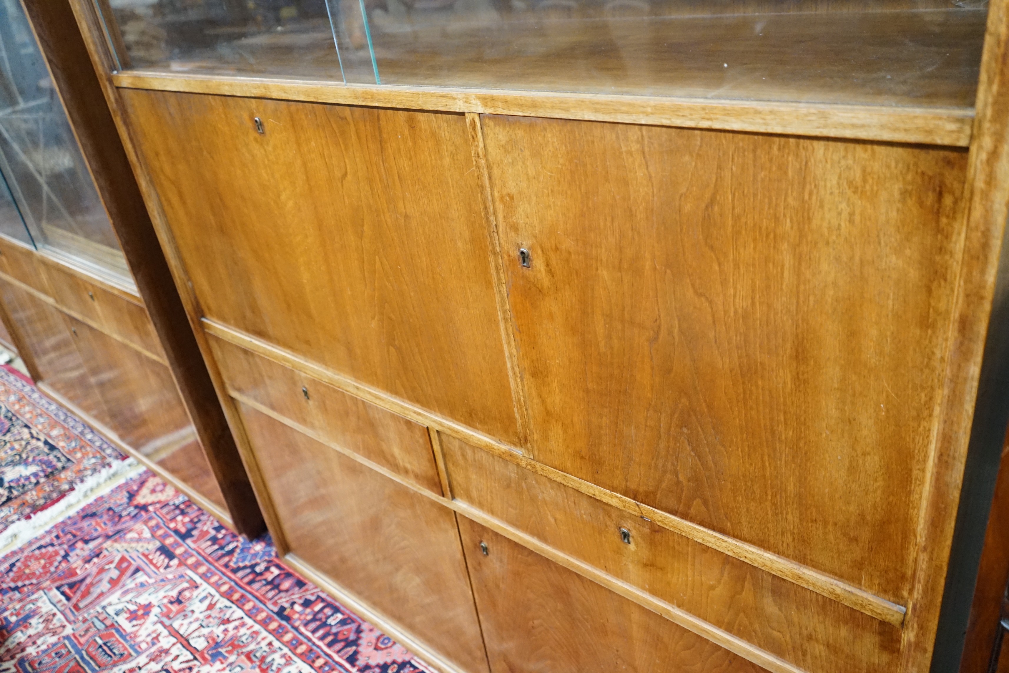 A mid century walnut writing cabinet by Georg Schoettle, Stuttgart, width 135cm, depth 40cm, height 160cm